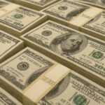 Neatly arranged stacks of $100 bills bound in $10,000 bands, symbolizing one million dollars